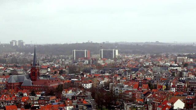 A zoomed in video of Brussels cityscape from the top of a church. The camera shows the houses, buildings and rooftops of the capital of Belgium. A great footage for urban or culture themes.