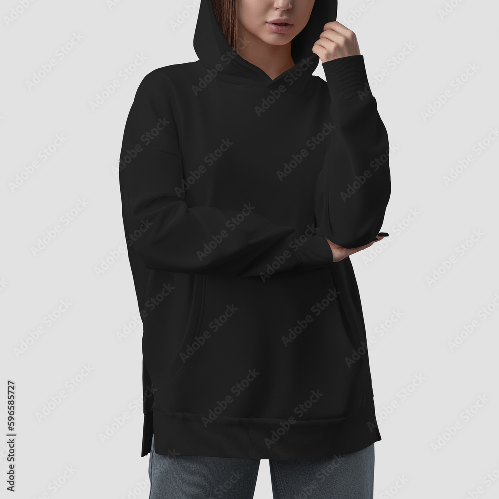 Wall mural Quality black hoodie template on a beautiful girl in a hood, empty apparel front view, women's shirt for design, brand, print.