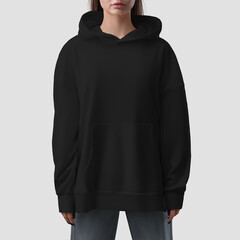Black hoodie mockup with slits on the sides on a beautiful girl, front view, isolated on background.