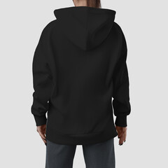 Mockup of a quality long black hoodie on a girl, back view, fashionable apparel for design, brand,...