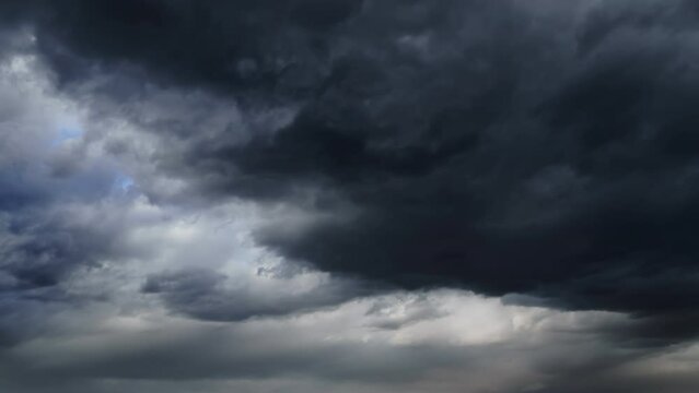 storm sky timelapse - dark dramatic clouds during thunderstorm, rain and wind, extreme weather, abstract background