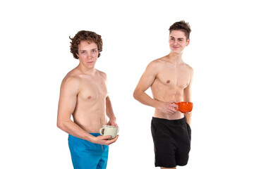 Two young attractive guys are drinking coffee. White background.