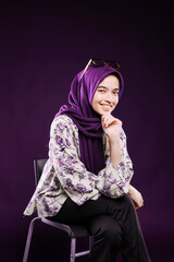 Beautiful business woman with hijab portrait on color background