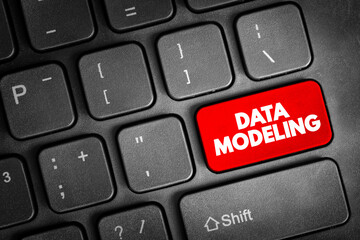 Data modeling - process of creating a data model for an information system by applying certain...