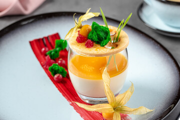Panna cotta on stone table in fine dining restaurant