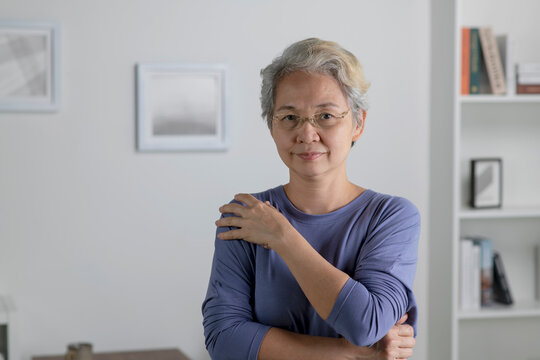 Portrait of healthy Asian senior woman in living room at home