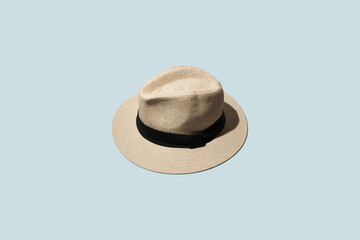 men's straw hat with brim on a blue background