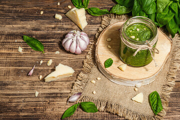 Homemade Italian basil pesto sauce in a glass jar