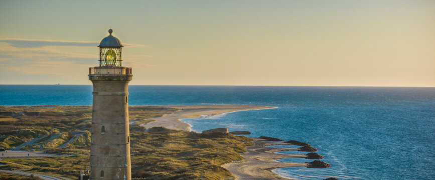 Panorama view of coastline with the famous Skagen Grey Lighthouse, Skagen Gr&aring; Fyr, Skagen, Grenen in North Jutland in Denmark,Skagerrak,North Sea, Baltic Sea.Upper tower platform,lantern of lighthouse
