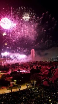 March 19, 2023 in Valencia. Spectators watch the fireworks in Valencia at the Fallas on Saint Joseph's Day. Bright lights in the evening in spring.