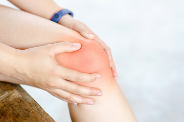 Female body knee pain due to exercise or osteoarthritis. Health care concept.