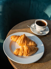 croissant and cup of coffee