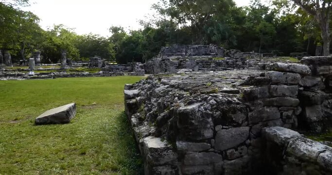 "The Altar" in Center of Plaza, in the background Las Columnas (The Columns) on the left, and Los Nichos (The Niches) at San Gervasio, Mayan archeological site, Cozumel, Mexico.