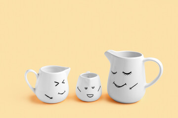 Pitchers with happy faces for Friendship Day on beige background
