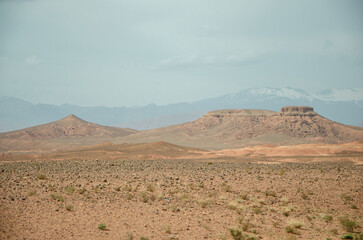 Desert landscapes in Morocco, desolate lands with paths that lead to remote and unexplored corners. Climate change and arid climate. Desertification and lack of water. Mountains and hills 