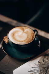 cup of cappuccino on the table