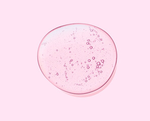 Cream gel pink transparent cosmetic sample texture with bubbles isolated on pink background