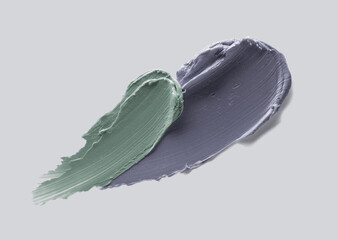 Cosmetic gray green texture kaolin clay mask swatch isolated on gray background