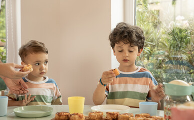 Kids having breakfast in kindergarten