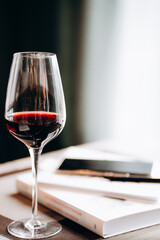 a glass of red wine on the desktop 