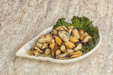 Tasty marinated mussels in the bowl