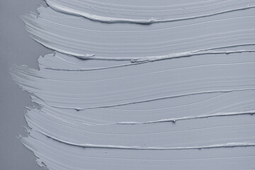 Cosmetic gray texture kaolin clay mask background