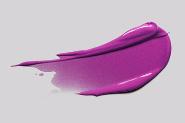 Lipstick lip gloss nail polish purple smudge isolated on beige background