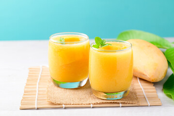 Fresh mango smoothie in glass, Cold drink in summer season