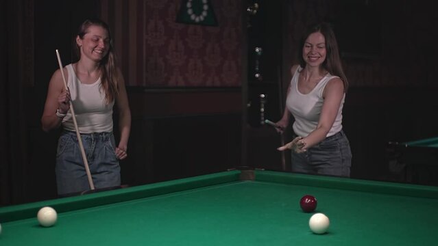 Russian billiards. two women play billiards. slow motion video. High quality Full HD video recording