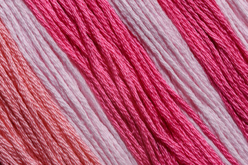 Fototapeta Tapeta tekstylna z różowej włóczka w różnych odcieniach w zbliżeniu makro obraz