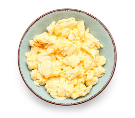 Plate of delicious scrambled eggs isolated on white background
