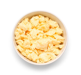 Bowl of delicious scrambled eggs isolated on white background