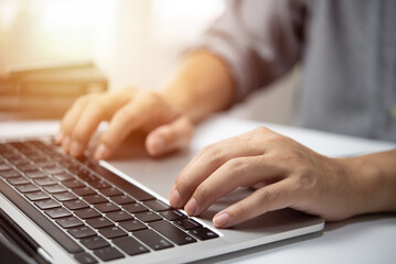 Businessperson using keyboard laptop computer job search, communication social networking, internet online Information, working data marketing concept.