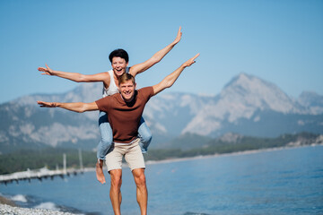 Obraz premium Couple in love opened their arms like the wings of an airplane. Trave concerts. High quality photo