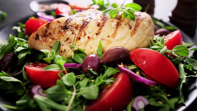 Salad with fresh vegetables and grilled chicken breast