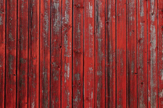 old red barn wood panel red paint texture that is flaking off 