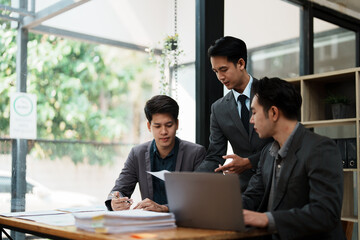 startup Asian business advisor meeting to analyze and discuss the situation on the financial report in the meeting room.Investment Consultant, Financial , teamwork ,brainstorming and accounting