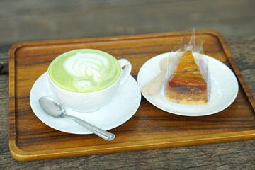 Hot green tea. Flower bubbles in a glass.