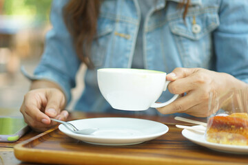 Woman drinking coffee in the morning before work
