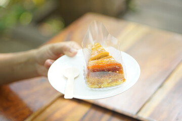 Woman eating cake in coffee cafe