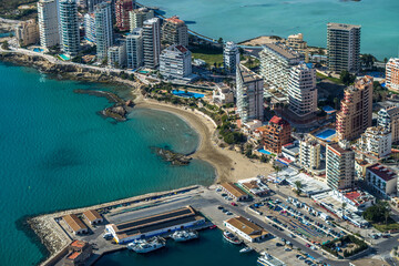 modern apartments, Cantal Roig beach and sailboats and fishing boats in the port of Calpe. Top view, horizontal