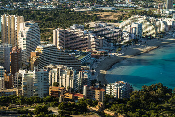 Fototapeta na wymiar modern apartments, Cantal Roig beach and sailboats and fishing boats in the port of Calpe. Top view, horizontal