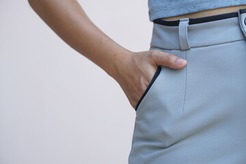 Asian woman dig into one's pants