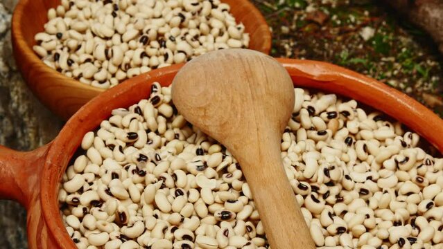 ceramic bowl with uncooked black-eyed peas in it