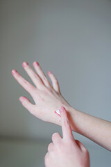 Scratch on the hand smeared with cream. The wound happen during girl play with cat.