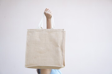 world plastic free day Women use cloth bags instead of plastic bags for shopping.