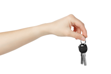 Hand holding keys to apartment on white background.