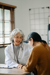 Obraz premium Psychology, depression. Suffering asian old woman, consulting with psychologist, psychiatrist while patient counseling mental problem. Encouraging, therapy, health care..