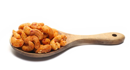 Cashews nuts with cheese and chilli in wooden spoon isolated on white 