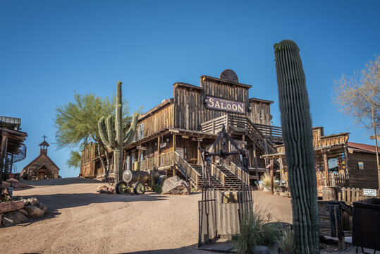GOLDFIELD, ARIZONA, USA - MAY 17, 2016 : Old saloon and wooden church in Goldfield Ghost town. Goldfield, later Youngsberg was a gold mining town, now a ghost town in Pinal County, Arizona.